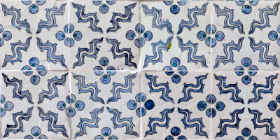 Eight tiles: four across, two deep. All the tiles have an identical pattern. The pattern repeats at the intersections.